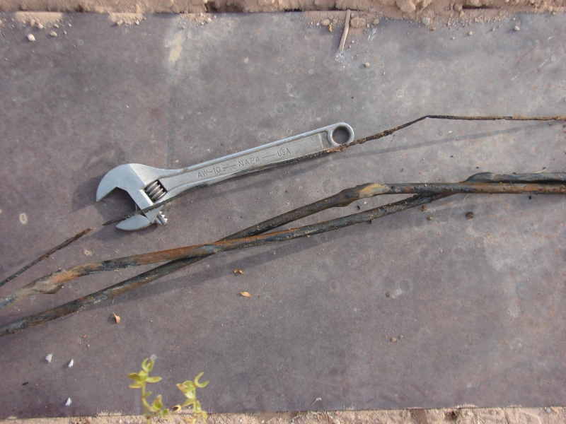 Power Line Damage with Wrench to Show Scale